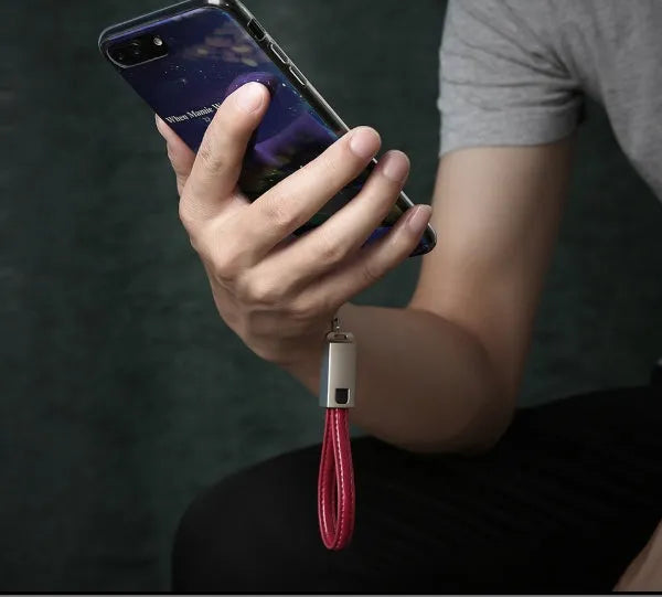 Leather and zinc alloy Lightning charging cable in red colour showing 20cm length with Lightning connector