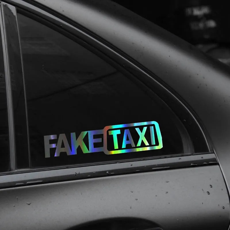 Waterproof black FAKE TAXI car sticker on a vehicle windshield, showing 20x8cm size.