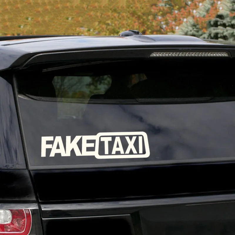 Waterproof black FAKE TAXI car sticker on a vehicle windshield, showing 20x8cm size.