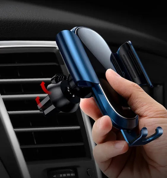 Universal car smartphone mount with adjustable clamp on a car air vent, showing 360-degree rotation.
