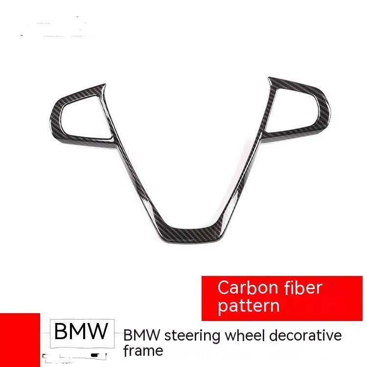 Carbon fibre pattern ABS plastic overlay frame for BMW steering wheel buttons.