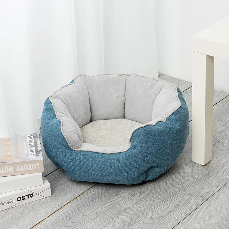 Blue octagonal pet bed with raised sides and a removable mat, for a small dog or cat.