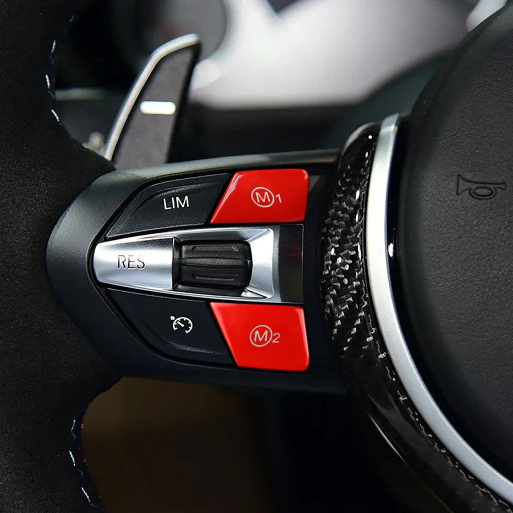Pair of red and blue M1M2 steering wheel mode buttons for BMW F30 and F34 models with installation keys.