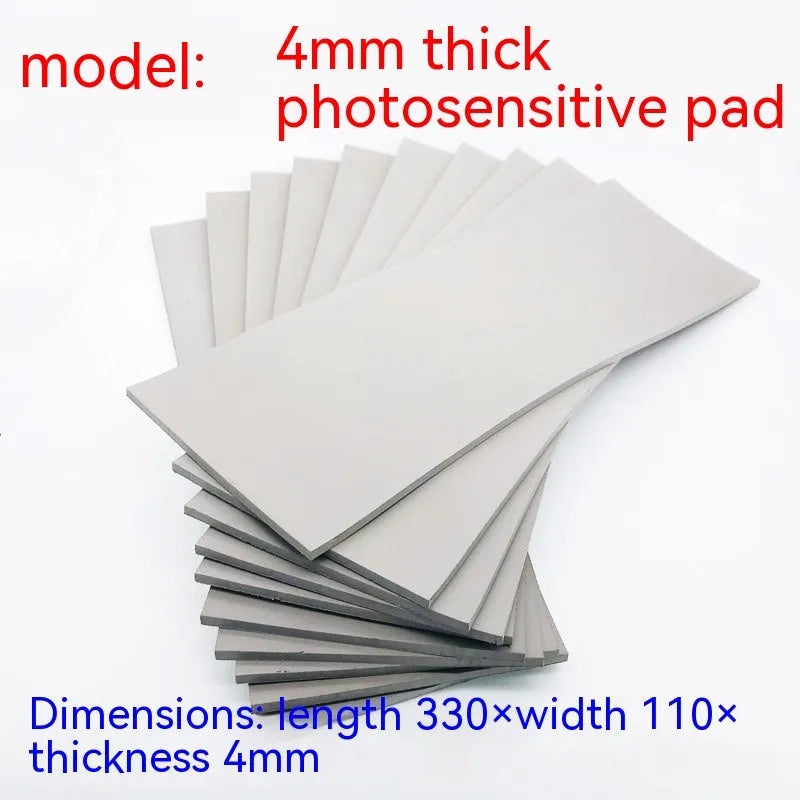 Black and grey plastic photosensitive mat for seal pottery, showing 330mm by 110mm sheet size.