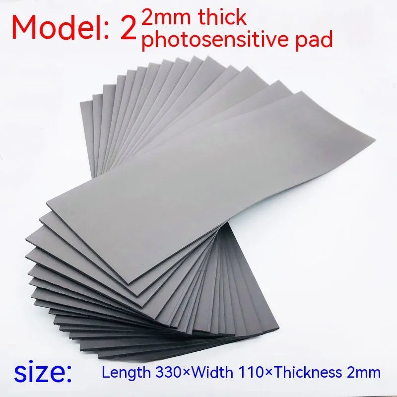 Black and grey plastic photosensitive mat for seal pottery, showing 330mm by 110mm sheet size.