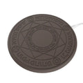 Square wireless charger with glowing magic array pattern design showing phone charging placement