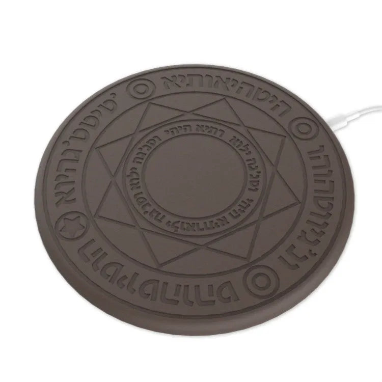 Square wireless charger with glowing magic array pattern design showing phone charging placement