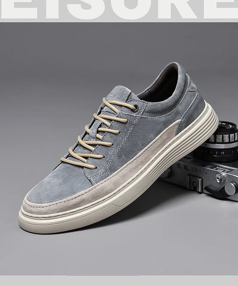 Men's grey casual skate shoes with pigskin upper and rubber sole, shown with front lace-up design and round toe