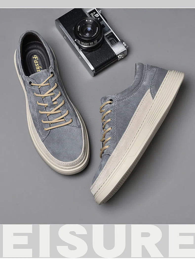 Men's grey casual skate shoes with pigskin upper and rubber sole, shown with front lace-up design and round toe