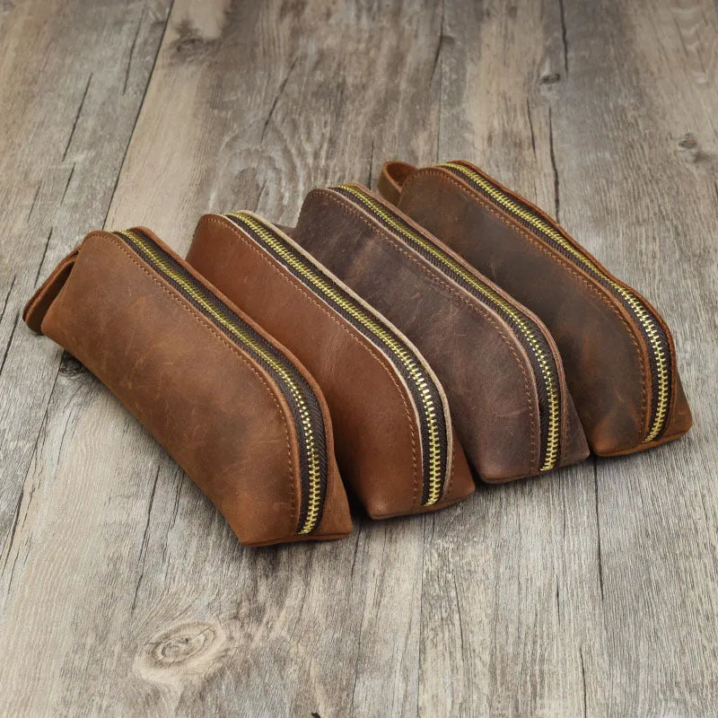 Square leather pencil case with zip closure in black colour showing 18cm dimensions