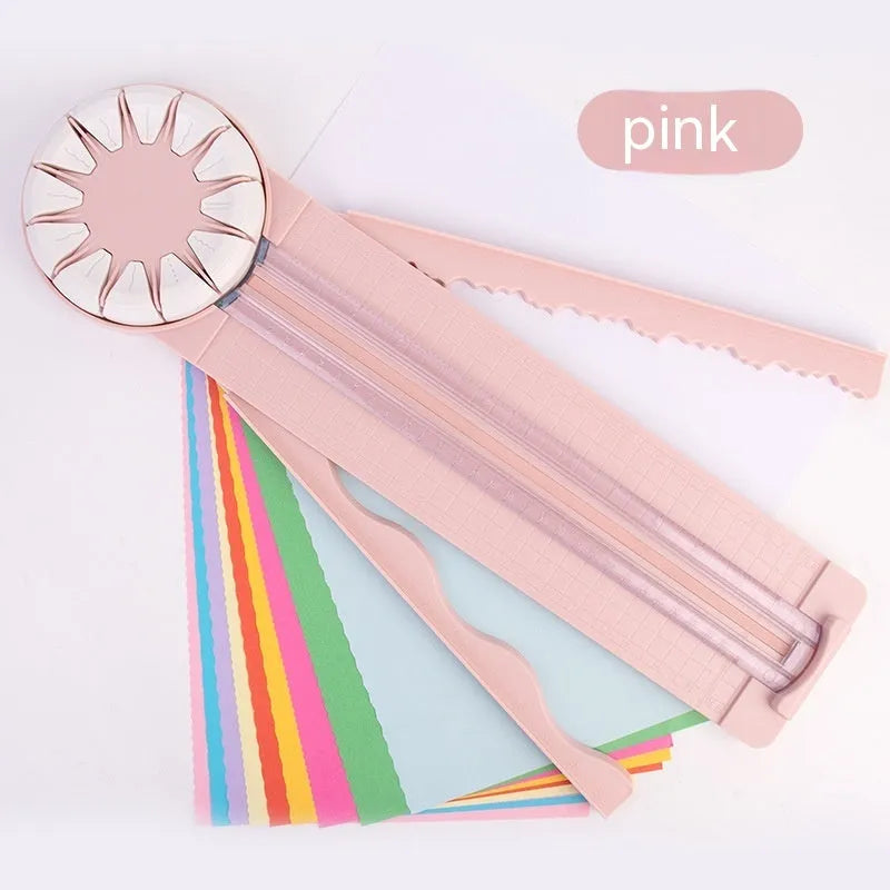 Pink plastic paper cutting machine with dotted pattern design and 12 interchangeable blades