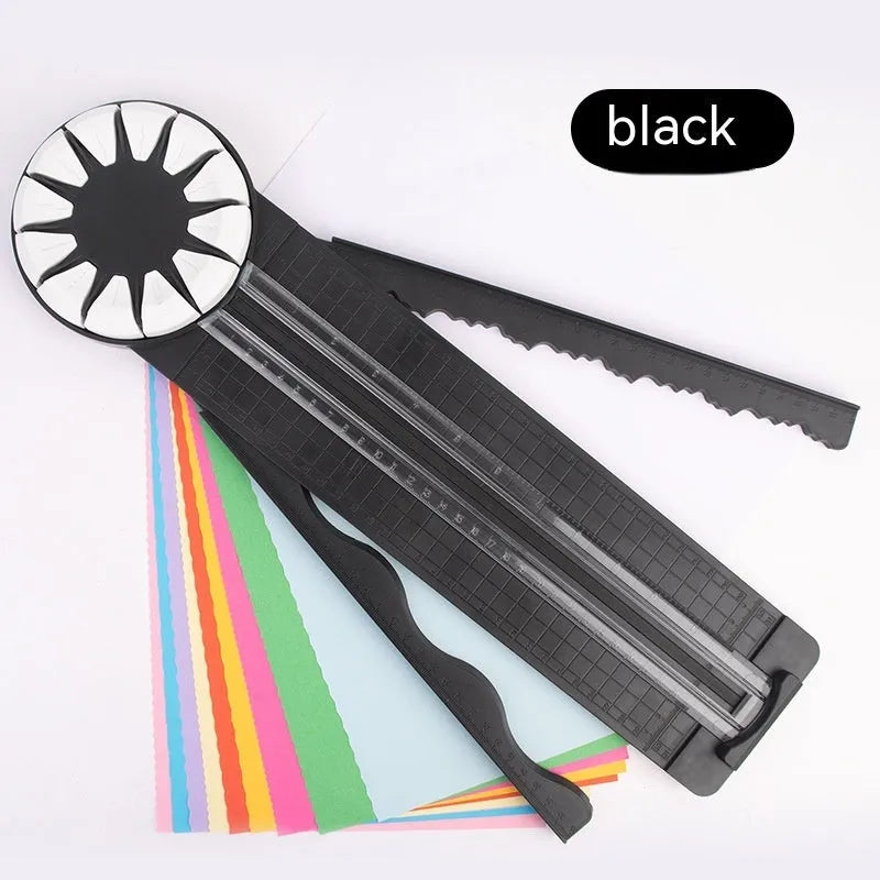 Pink plastic paper cutting machine with dotted pattern design and 12 interchangeable blades