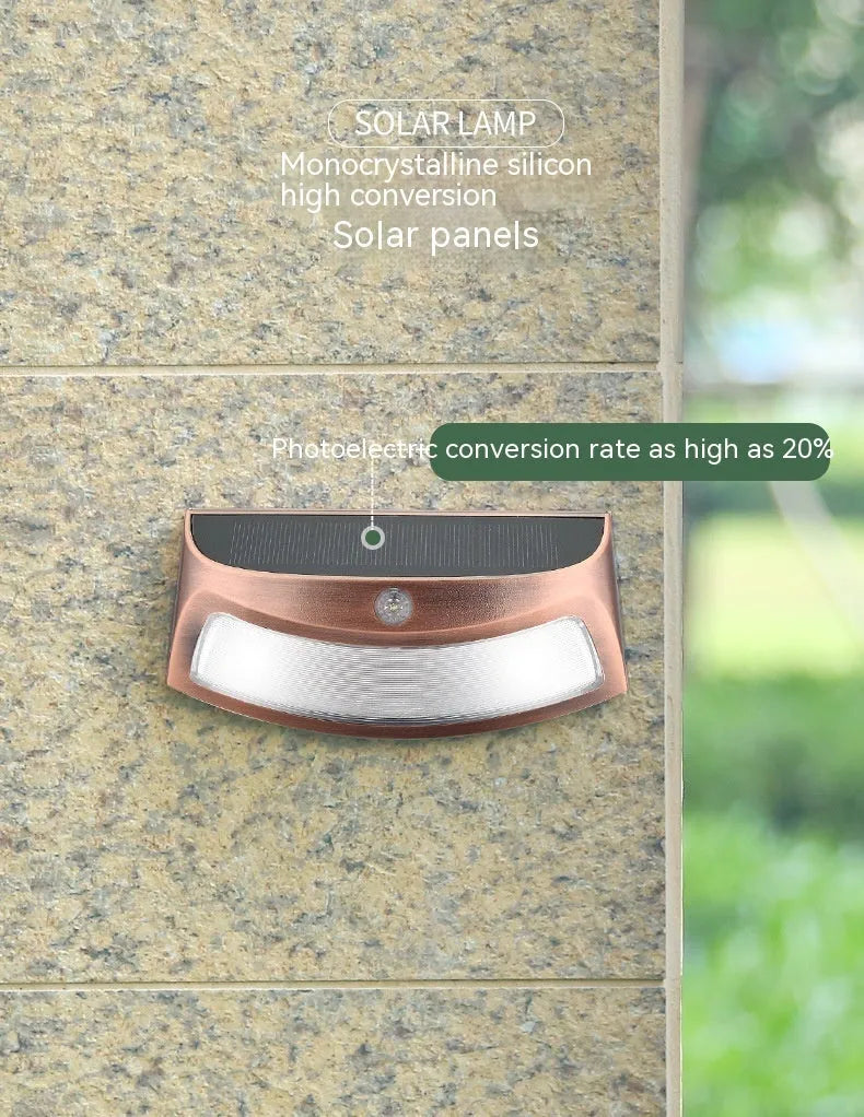 Solar outdoor wall lamp with smiling face design for garden decorative lighting