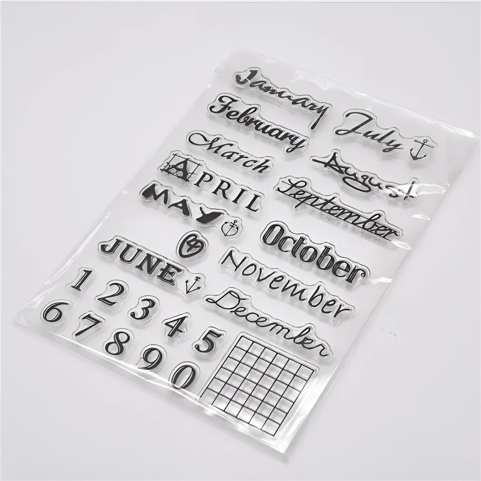Close-up of a transparent silicone vintage calendar seal stamp showing a digital table icon design.