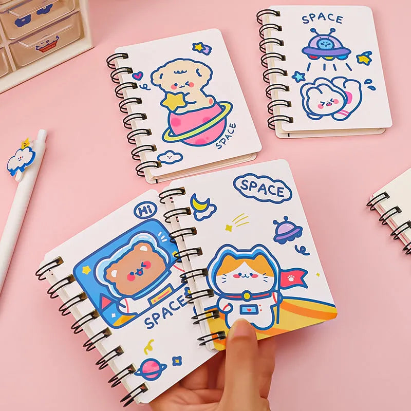 Astronaut pocket flipper notebook showing 10.5x8cm size with space-themed cover designs