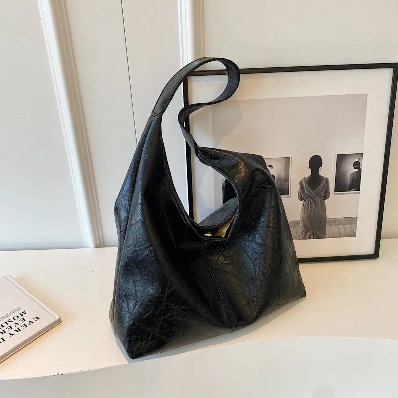 Soft PU leather shoulder bag with multiple external sandwich pockets in street-style design