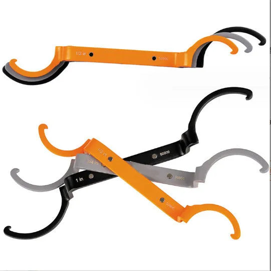 Three-piece wrench set showing orange, grey, and black wrenches with magnetic crescent and catheter locking types