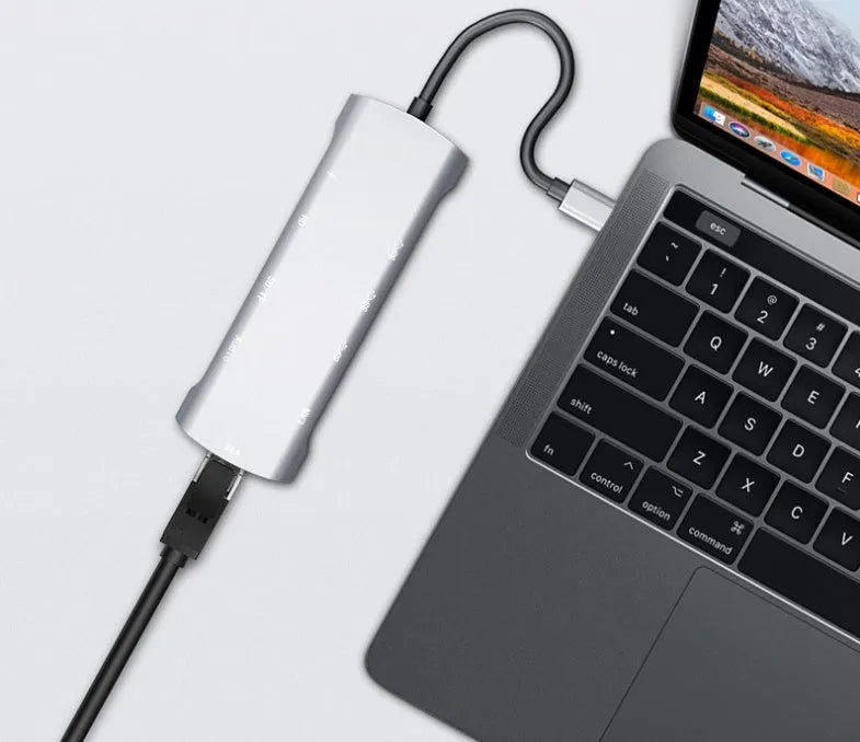 Grey aluminium USB-C docking station with HDMI, VGA, USB port, and a 140mm cable.