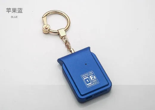 Bluetooth dual SIM adapter keychain for iOS with Nano SIM slot and Micro USB port.