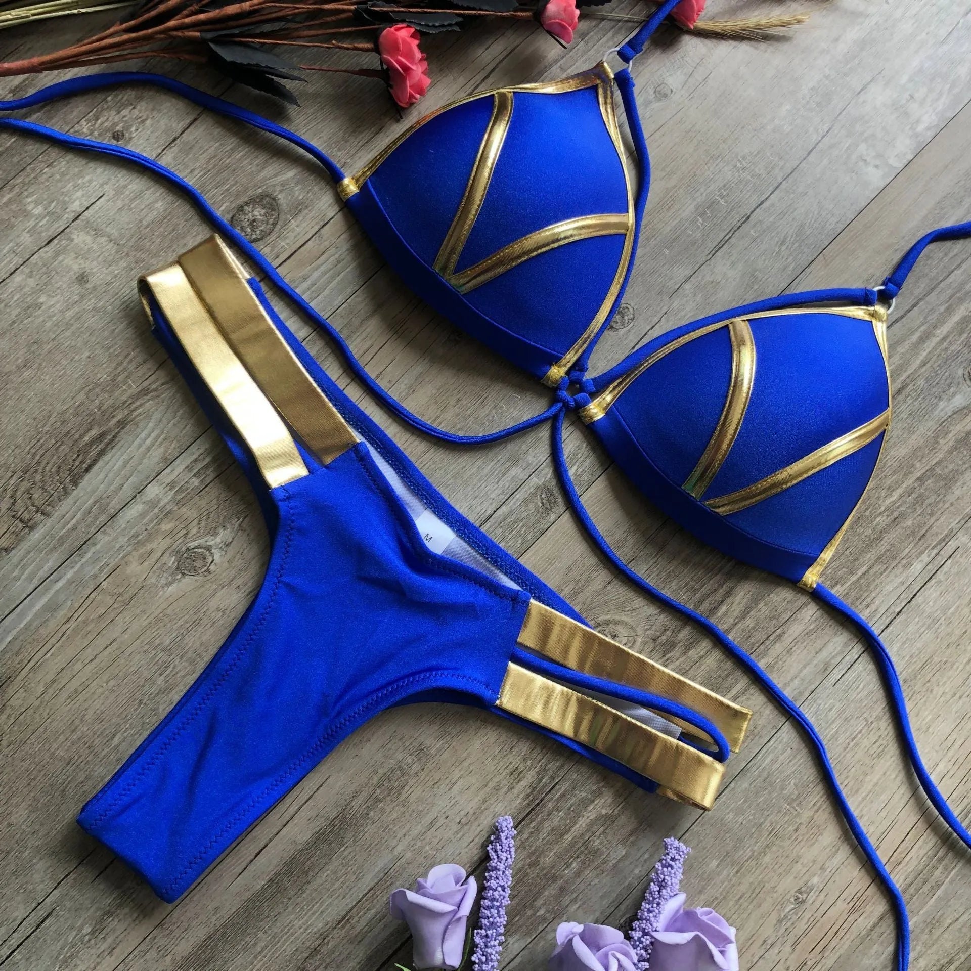 Female bronzing bikini swimwear with soft padding, shown in multiple colour and print options.