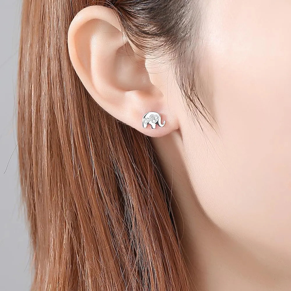 Small geometric drop earrings with gem setting in gold and silver colours