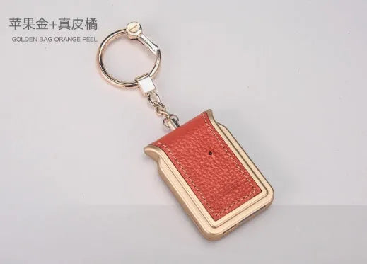 Bluetooth dual SIM adapter keychain for iOS with Nano SIM slot and Micro USB port.