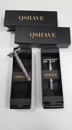 Double edged safety razor with stainless steel handle and closed comb head in storage box