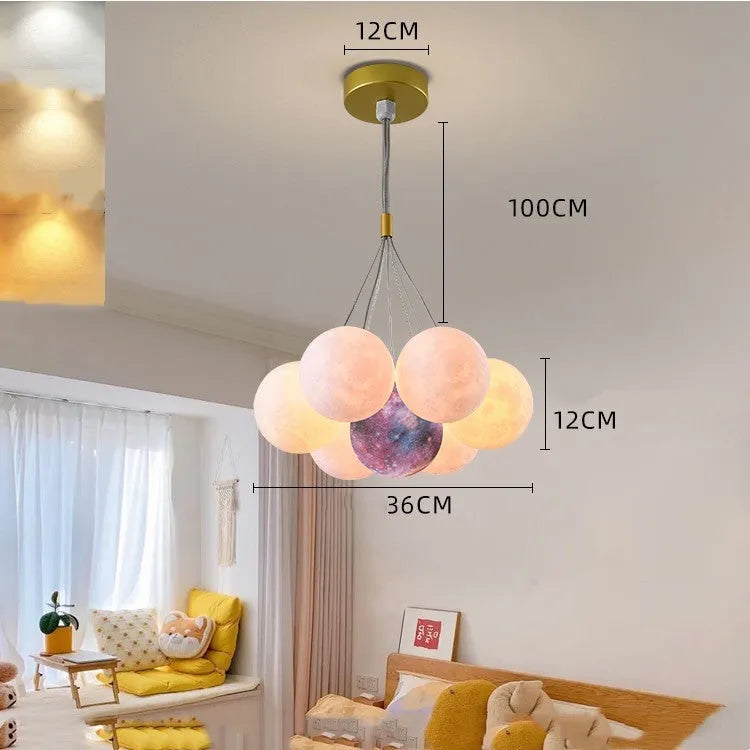 Nordic fish chandelier with moon bubble design in gold or black colours, showing iron body and PMMA lampshades