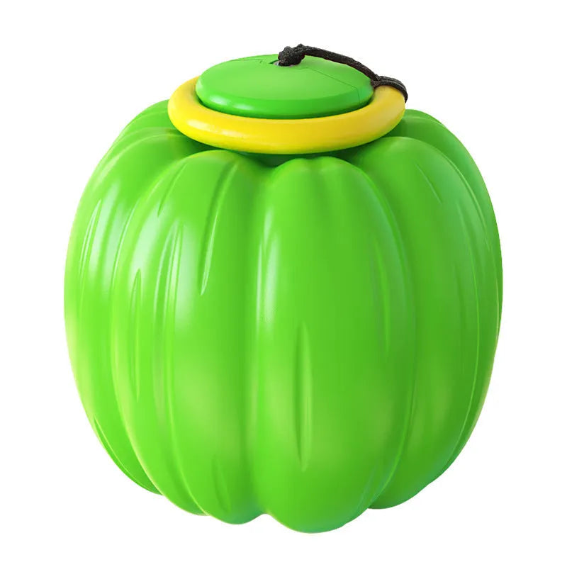 Green, orange, and yellow plastic pumpkin-shaped dog chew toy with squeaker.