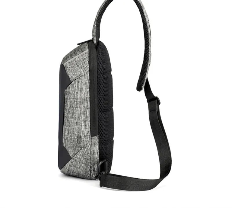 Small dark blue oxford cloth waterproof chest bag with a zipper and car suture detailing.