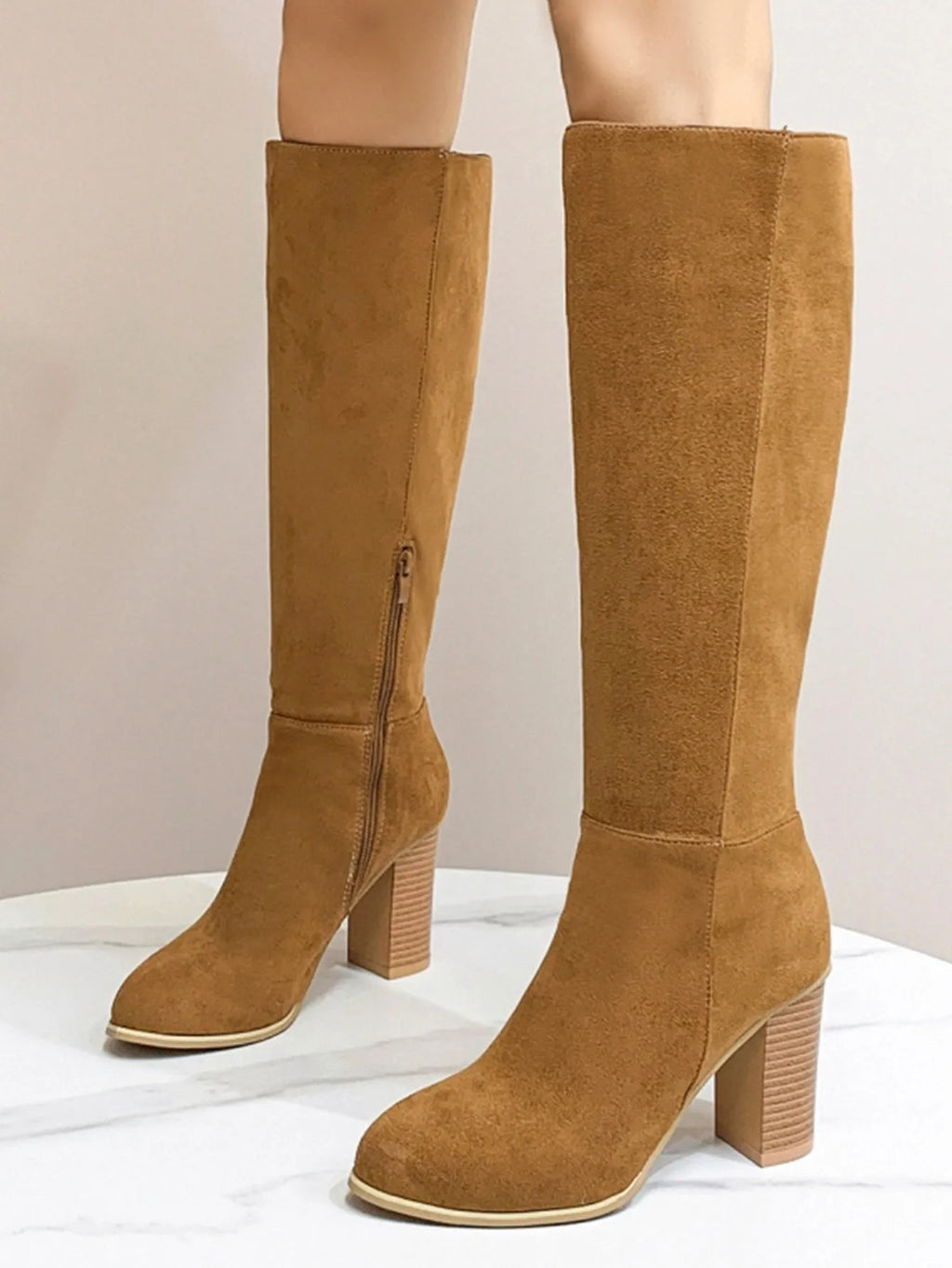 Women's black square toe high heel fashion boots made from artificial PU, shown from the side.