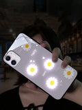 White luminous iPhone case with painted purple daisies and voice-activated colour light feature.