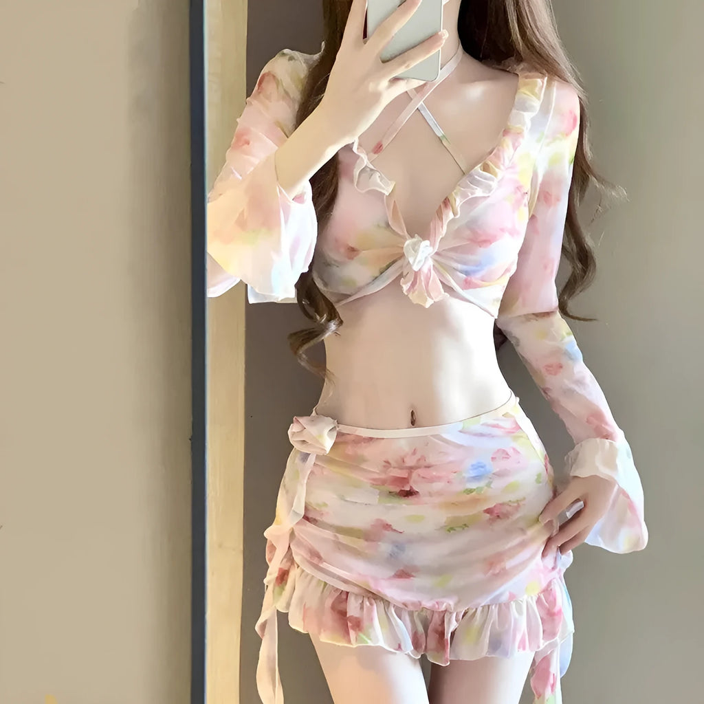 Women's cherry blossom pink floral bikini swimsuit laid flat.