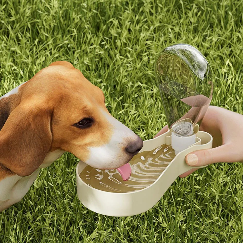 Orange and white portable pet water feeder showing water bottle and treat container compartments
