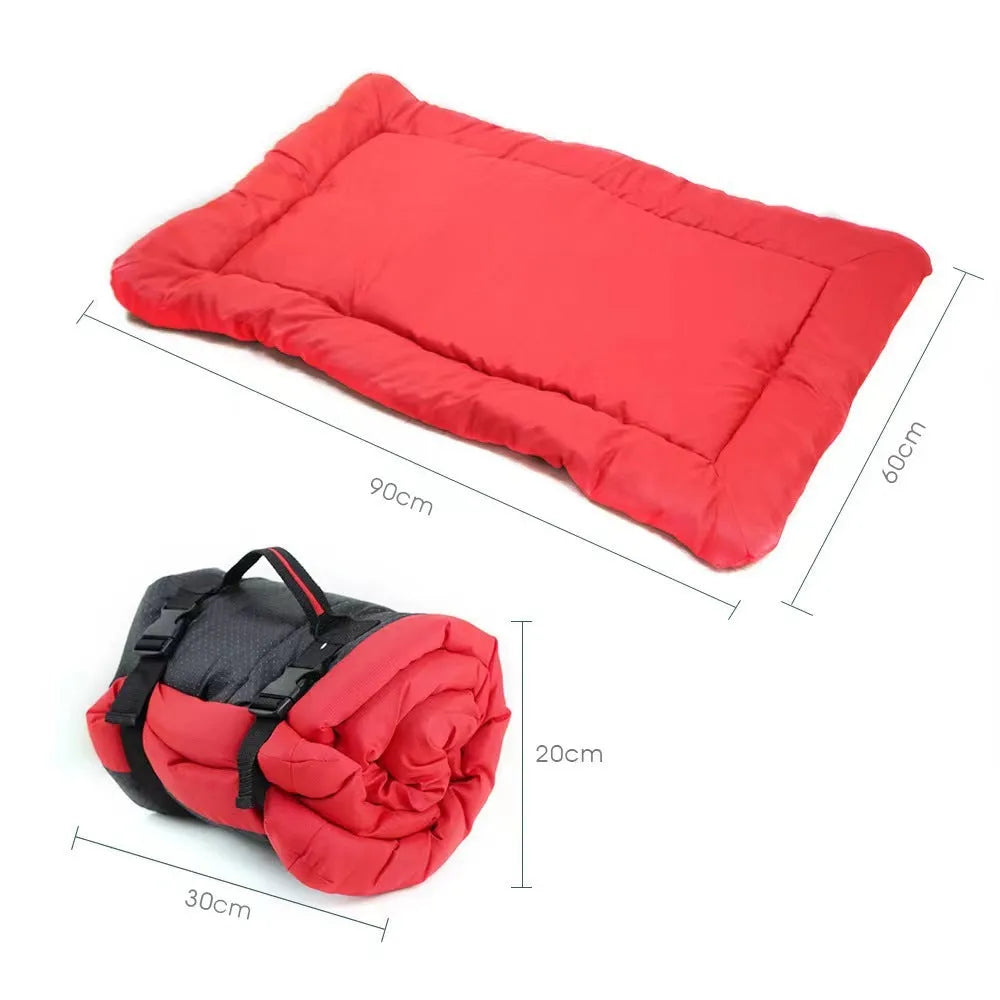 Blue foldable waterproof dog bed shown unfolded and folded, with nylon buckles and dotted anti-slip bottom.