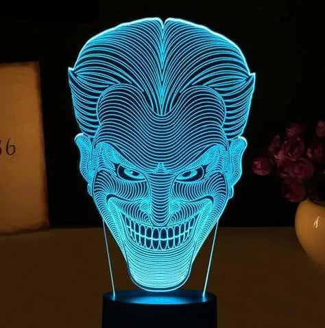 3D acrylic LED lamp showing colourful illumination on a square base, with remote control and USB cable