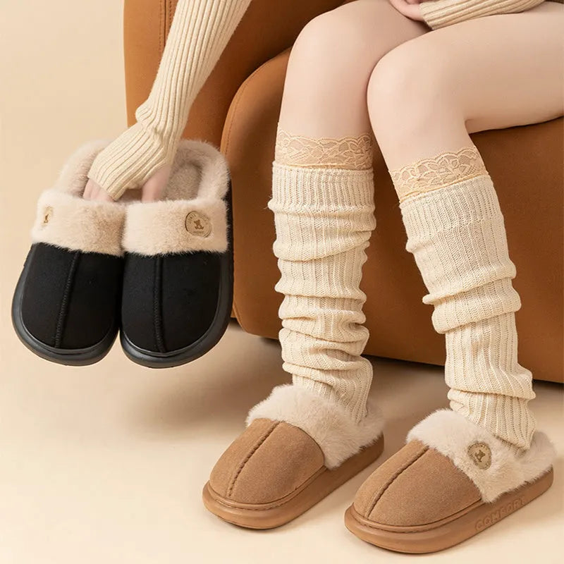 Plush fleece indoor slippers with thick PVC non-slip soles in multiple colours.