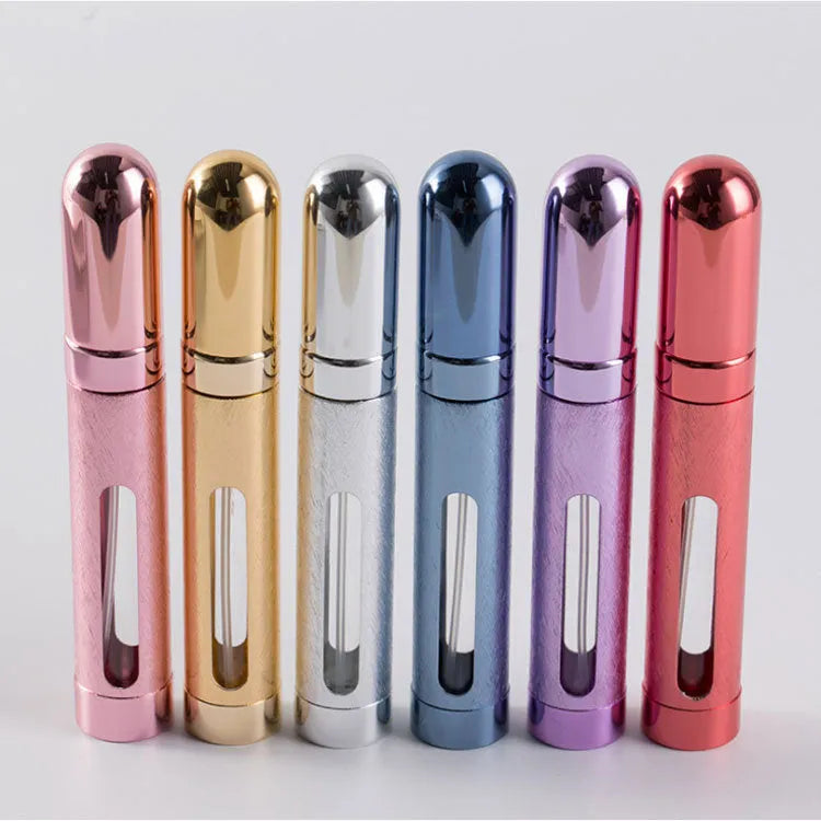 Slender aluminium travel perfume bottle with glass liner in a choice of six colours, shown next to a ruler showing 115mm length.