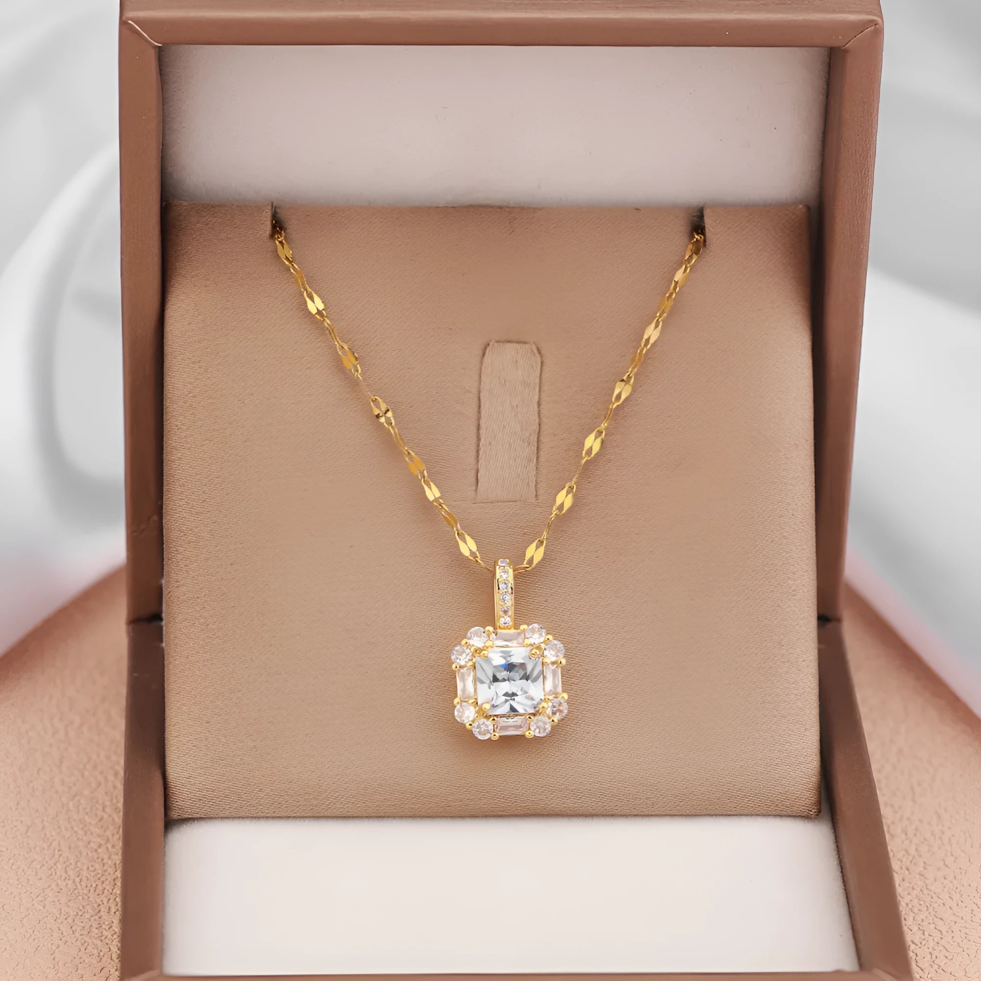 Women's gold geometric pendant necklace with mixed gemstone inlay on water wave chain