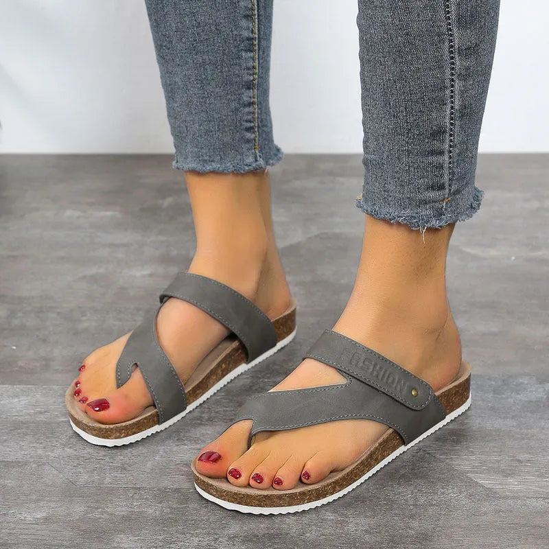 Blue flat toe ring flip-flops with a thick foam sole on a solid background.