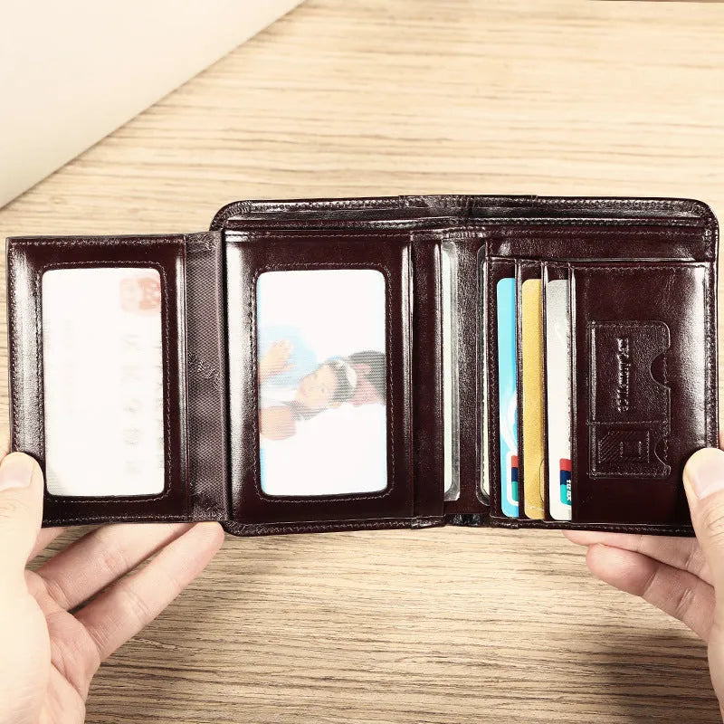 Men's leather wallet open showing photo slot, card holders, banknote section and change compartment
