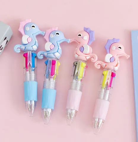 Four-colour press-action ballpoint pen with cartoon-themed refills and 0.7mm bullet tip
