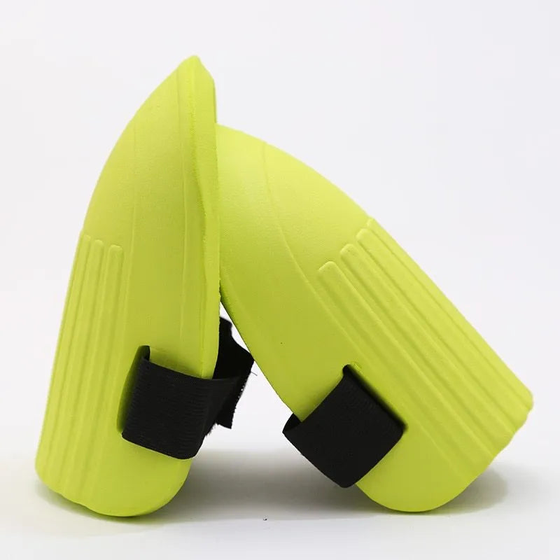 A pair of simple black EVA foam knee pads for gardening, showing their rectangular shape and thickness.