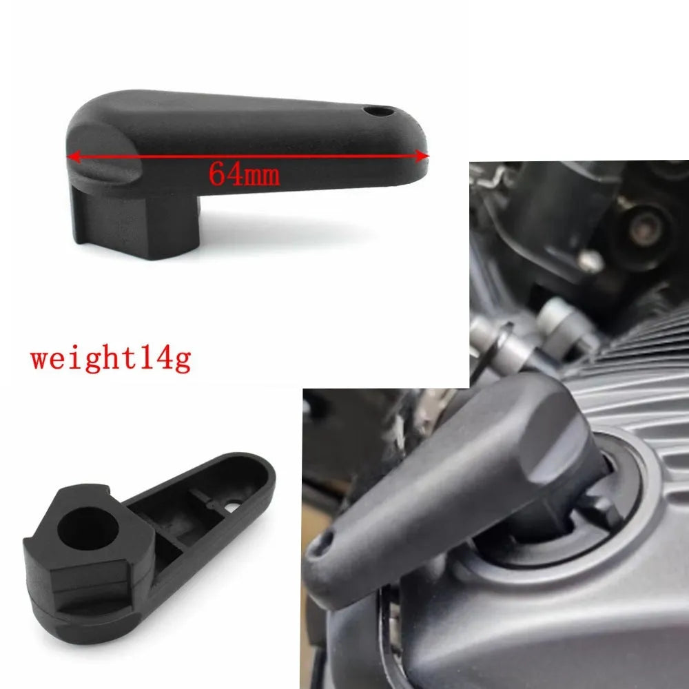 Black nylon quick release wrench for BMW motorcycle oil cap on a 7x10x3 cm scale.