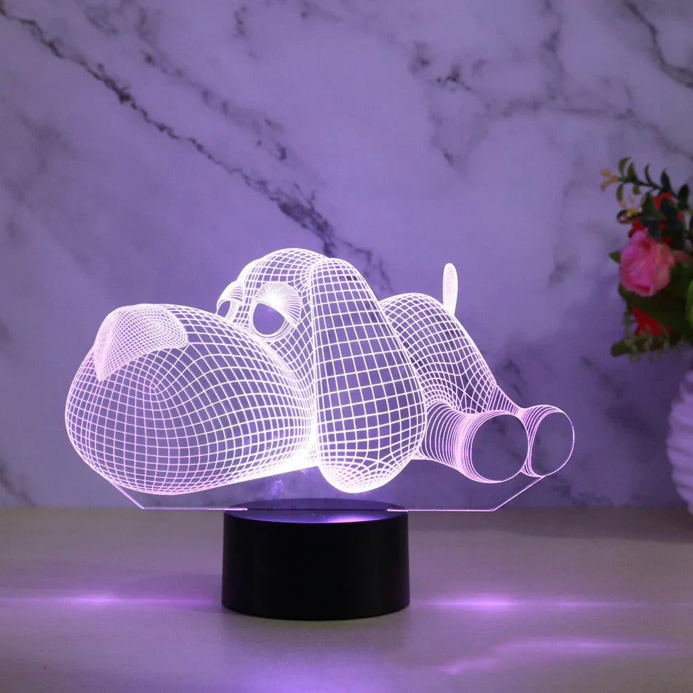 Dog-shaped desktop lamp glowing in blue, with touch button and USB cable.