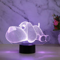 Dog-shaped desktop lamp glowing in blue, with touch button and USB cable.