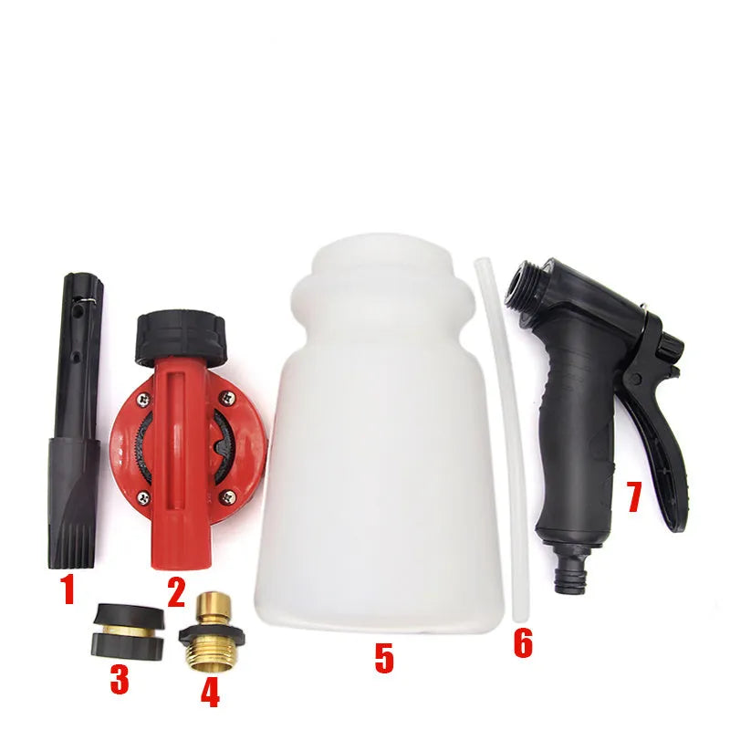 Green foam pot high pressure water gun for garden spraying on a wooden table.