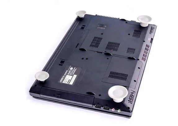Set of four grey non-slip plastic cooling pads for laptops, shown in two different sizes.