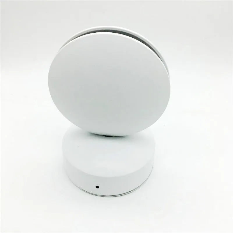 Modern aluminium LED bar wall lamp with glass lens, shown in a corridor setting.