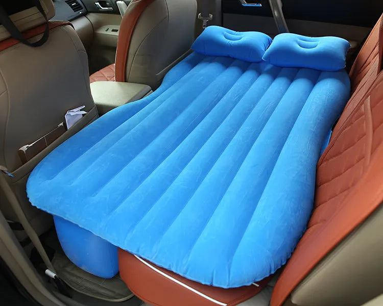 Universal inflatable car bed with flocking material, shown with pump, pillows, and storage bag.